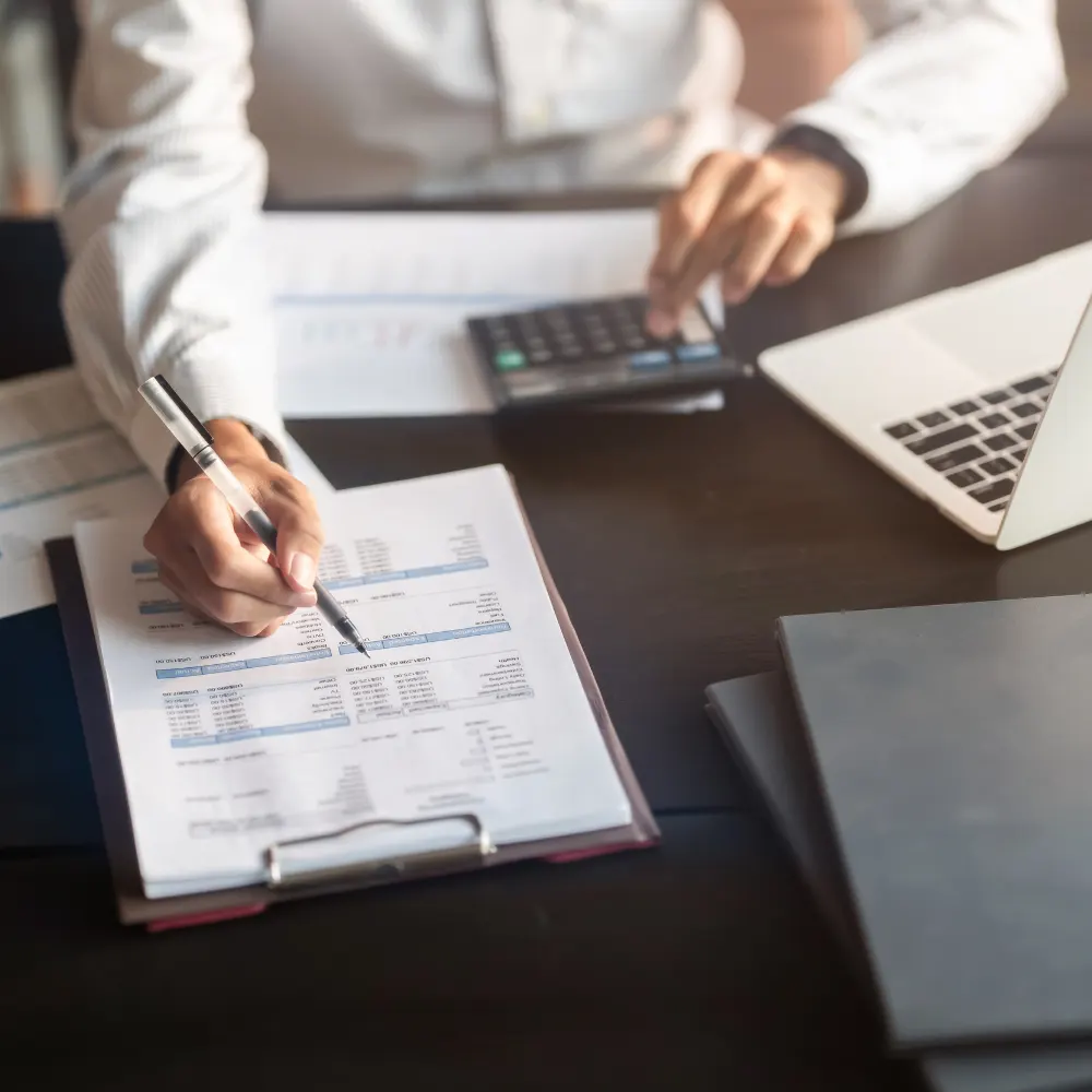 A business accountant working out finances.